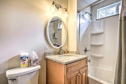 a bathroom with a sink and a mirror at Indian Lake Retreat with Wet Bar and Covered Deck in Stoystown