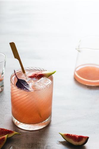 a glass of strawberry margarita with a spoon in it at Maxwell Residences at Indah in Puerto Vallarta