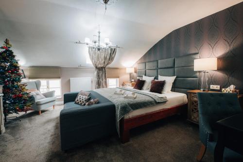 Postel nebo postele na pokoji v ubytování Hotel Telč