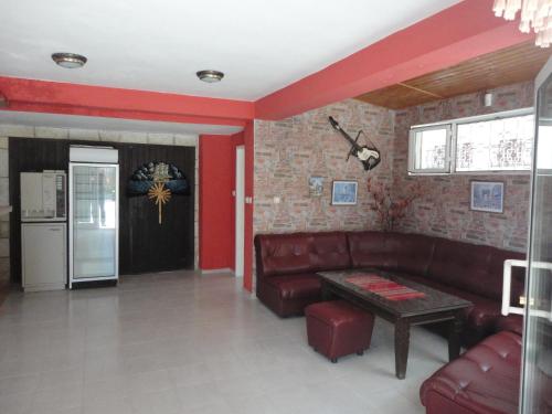 a living room with a couch and a table at Guest Rooms Casa Luba in Sveti Vlas
