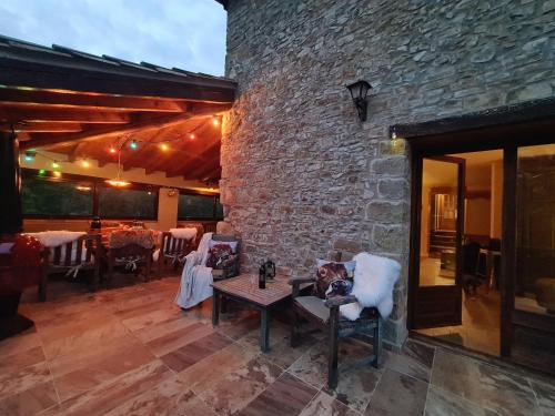 a dog sitting on a chair on a patio at Harveys Homestay - Adults only in Mieres