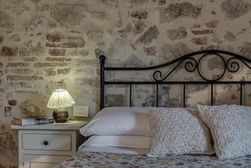 Ένα ή περισσότερα κρεβάτια σε δωμάτιο στο Borgo Al Cerro