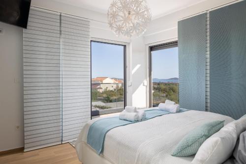Postel nebo postele na pokoji v ubytování Luxury villa Mia