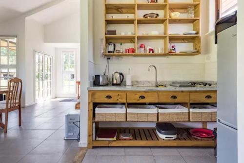 a kitchen with a sink and a counter top at Casa Galpón en la Laguna de Aculeo in Paine