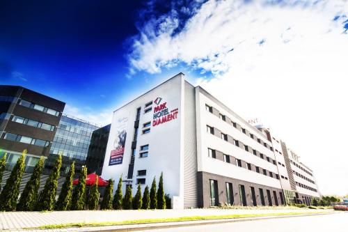 a building with a sign on the side of it at Park Hotel Diament Wroclaw in Wrocław