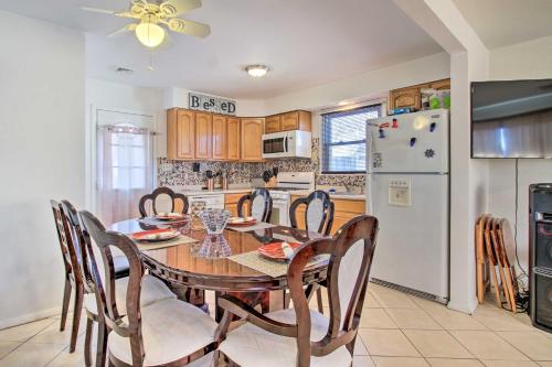 a kitchen with a table and chairs and a refrigerator at House with Pellet Smoker and Grill, 1 Mi to Lake! in Bellmawr