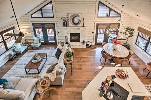 an overhead view of a living room with a table at Enchanting Forested Cabin with Fire Pit and Grill in Sulphur Springs