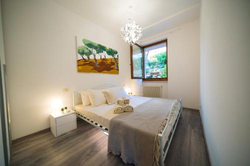 A bed or beds in a room at ULIVI Beth's House
