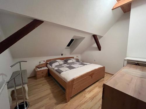 a bedroom with a large bed in a attic at Ferienwohnungen Fam. Pabst in Maria Lankowitz