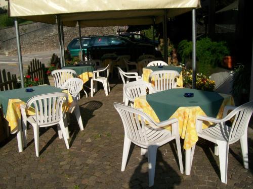 a group of tables and chairs under a tent at Albergo Bellavista in Castello Tesino