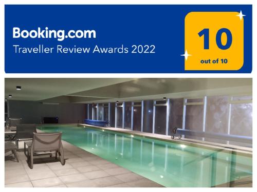 a swimming pool for a hotel review awards with the words out at Vista Privilegiada in Punta del Este