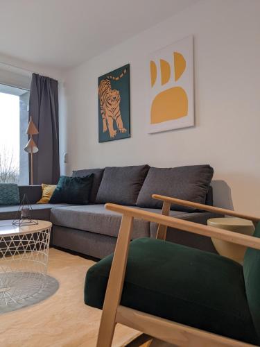 a living room with a couch and a table at Zentrale und gemütliche Ferienwohnung in Winterberg nah an der Natur in Winterberg