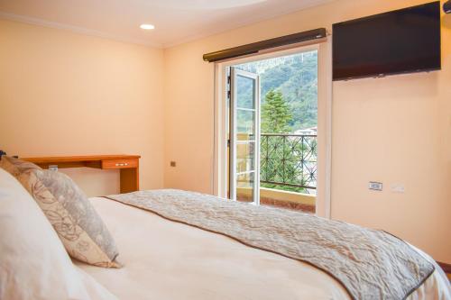 Postel nebo postele na pokoji v ubytování Orígenes Arcabuco Hotel Boutique