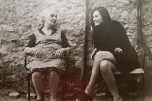 an old photo of a woman sitting next to a man at Casa Lisa in Finale Ligure