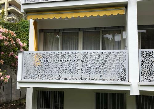 a balcony of a house with a white fence at Casa Roccalta in Ascona