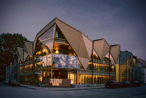 a large building with a lot of windows at Kurshi Hotel & Spa in Jūrmala