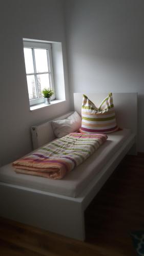 Una cama o camas en una habitación de Ferienwohnung Straubing/Dingolfing