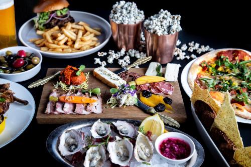 a table with a bunch of different types of food at Fairmont Empress Hotel in Victoria