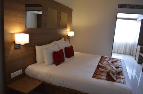 Regency Tiruttani by GRT Hotelsにあるベッド