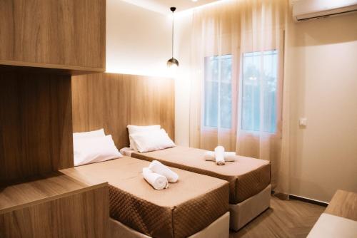 Posteľ alebo postele v izbe v ubytovaní Syvota Apartments Family