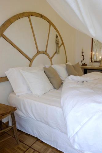 two beds in a room with a large white bed at Ca'Bevilacqua Bed&Breakfast in Bertinoro