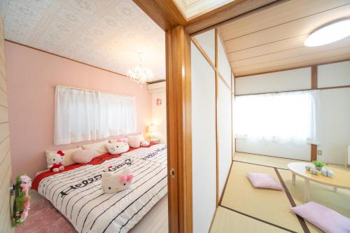 Ліжко або ліжка в номері Yokkaichi Higashihino Hotel