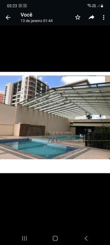 a picture of a building with a swimming pool at Nobile Congonhas in Sao Paulo