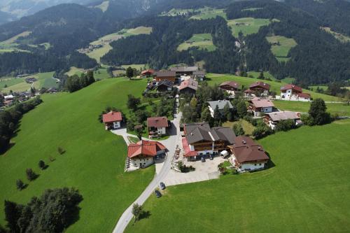 an aerial view of a house in a green field at Gasthof Schöntal in Oberau