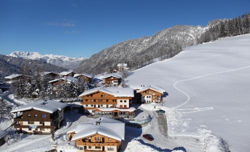 an aerial view of a resort in the snow at Gasthof Schöntal in Oberau