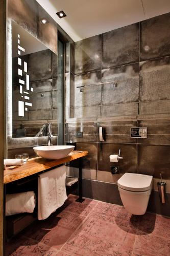 a bathroom with a sink and a toilet at Hotel The Public - Special Category in Istanbul