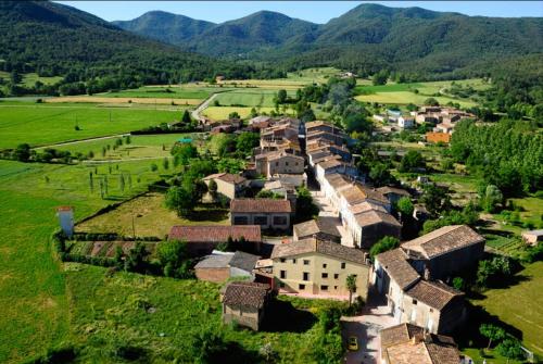 an aerial view of a village in the mountains at Harveys Homestay - Adults only in Mieres