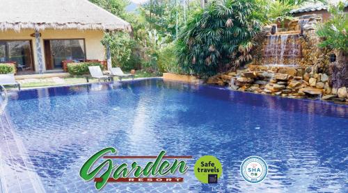 a swimming pool at a resort with a water slide at Garden Resort in Ko Chang