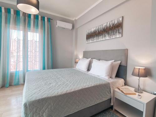Ένα ή περισσότερα κρεβάτια σε δωμάτιο στο Azure Mare Studios