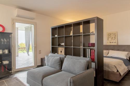 Ένα ή περισσότερα κρεβάτια σε δωμάτιο στο Studio Colline di Bardolino