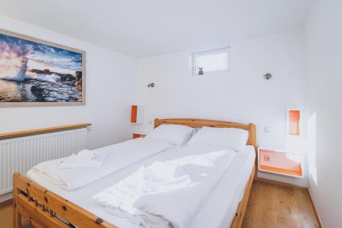 Postelja oz. postelje v sobi nastanitve Panorama Chalet Schmittendrin by we rent, SUMMERCARD INCLUDED