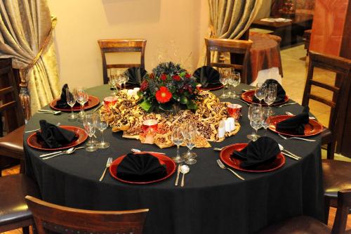 a table with a black table cloth with a black table cloth at Anta Boga Hotel in Bloemfontein