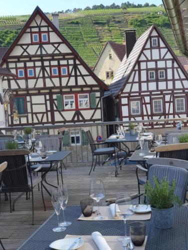 a restaurant with tables and chairs on a patio at Hotel Restaurant Lamm Rosswag in Vaihingen an der Enz
