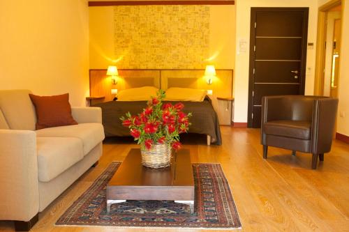 a living room with a couch and a table at Montebelli Agriturismo & Country Hotel in Caldana