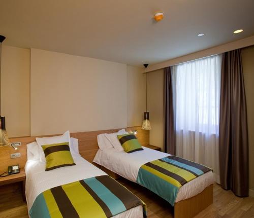 Letto o letti in una camera di Hotel Vall de Núria