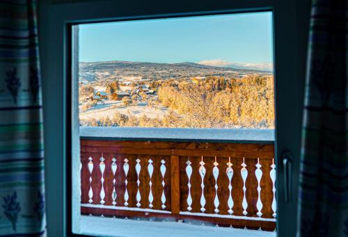 a window with a view of a snow covered town at Apartment Lannach in Lannach