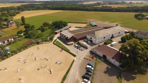 an aerial view of a building with a parking lot at Penzion Jízdárna Suchá in Litomyšl