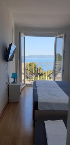 Postel nebo postele na pokoji v ubytování Apartments Oliva