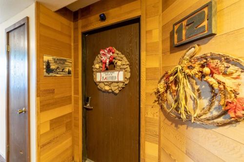 a room with a door with a sign on it at Giant Steps 12 Rustic Retreat ski in out in Brian Head