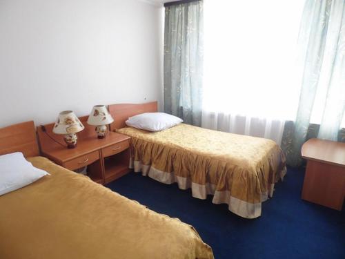 Tempat tidur dalam kamar di Vorkuta Hotel