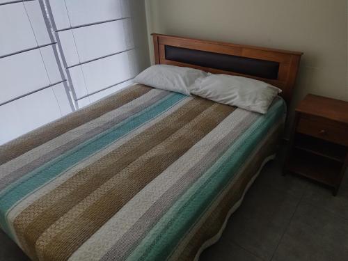 Postel nebo postele na pokoji v ubytování Apartamento JATUN MAMA
