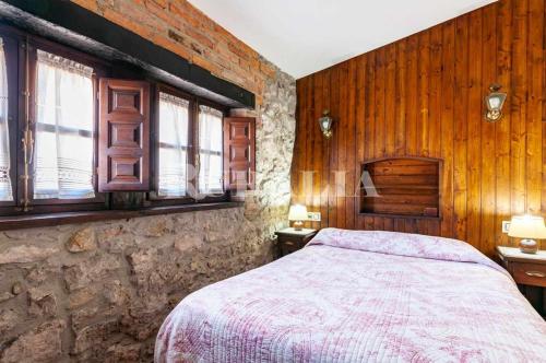 A bed or beds in a room at Casa Carmen 5 Situada en una zona muy tranquila a
