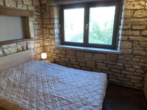 Ένα ή περισσότερα κρεβάτια σε δωμάτιο στο Kalpaki stone apartment 2.