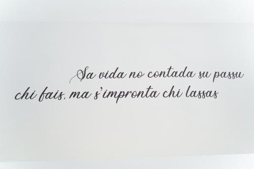 a letter with a handwritten text on a white background at Sunshine Charming Houses in Alghero