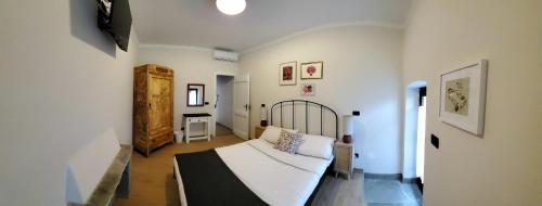 Postel nebo postele na pokoji v ubytování B&B L'orto del Geo