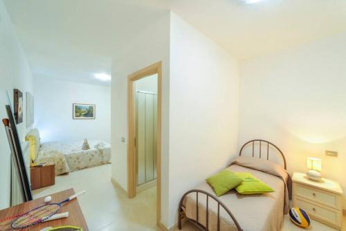 Postel nebo postele na pokoji v ubytování La Natura, spazioso appartamento in villa